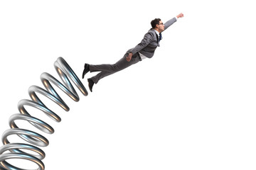 Businessman jumping from spring in promotion concept