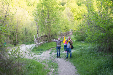 Family walking in the woods