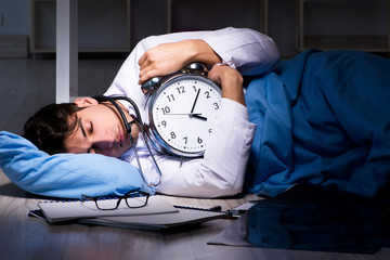 Doctor working night shift in hospital after long hours