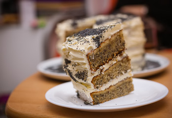 slice of poppy seed cake with creamy glaze