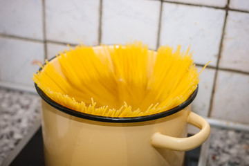 Spaghetti put in hot water in a pot and boil