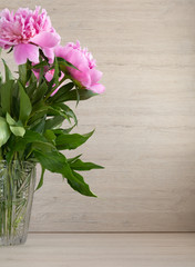 Beautiful pink peonies in a crystal vase to Mother's Day