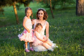 Naklejka premium woman and children in nature