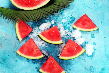 watermelon on blue background. juicy summer fruit in slices
