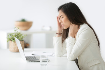 Stressed asian businesswoman having headache at work concept, frustrated dizzy chinese woman touching temple tired of aching head or chronic fatigue in office, korean employee feels strong migraine