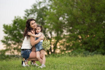 Fototapeta premium woman and child in nature