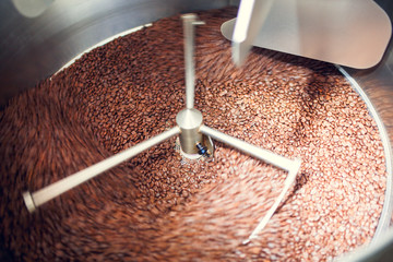 Photo of coffee beans in industrial roaster