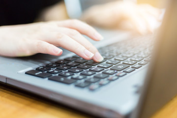 close up hand of businesswoman typing keyboard on laptop. business people and technology concept.