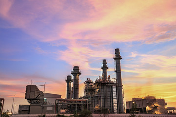 Fototapeta na wymiar Gas turbine electrical power plant at dusk with twilight 