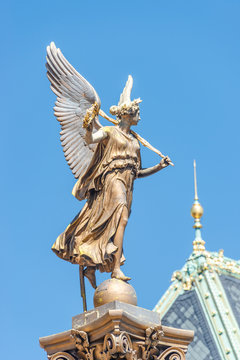 Statue of beautiful angel with wings in front of the Rudolfinum concert hall in Prague, Czech Republic