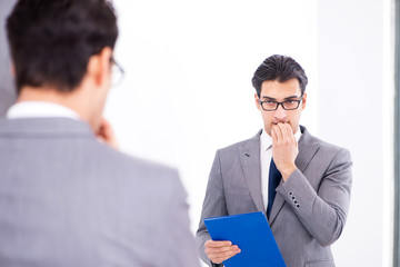 Politician planning speach in front of mirror