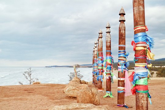 Sacred poles on Olkhon Island / Colored ribbons on the thirteen sacred poles on Olkhon Island in Lake Baikal, Russia. Taken in late winter, all water turns in white ice