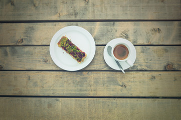 Coffee and cake on table outside