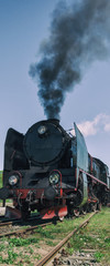 Fototapeta premium STEAM LOCOMOTIVE - Vintage train at the station