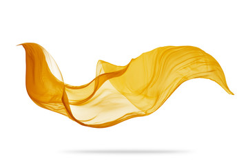 Piece of flying golden cloth on white background