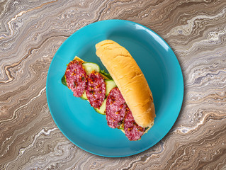sandwich with salami, cheese and vegetables