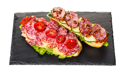 sandwich with salami, cheese and vegetables