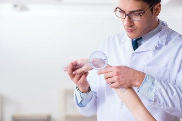 Doctor checking patients joint flexibility