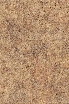 High resolution photograph of recycle paper light brown coarse grain mottled grunge texture sample
