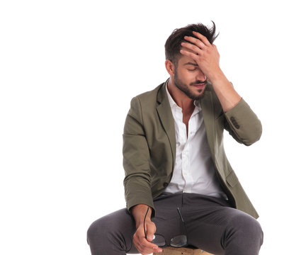 Portrait Of Tired Elegant Man Resting Face In His Palm