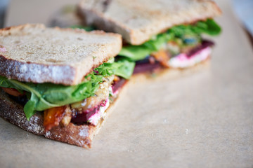 Delicious gourment sandwich of mixed vegetables on a serving board