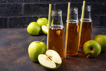 Bottles with fresh apple juice 