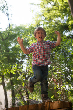 Little boy making gestures to the lame leg.