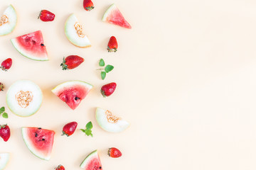 Fruit background. Watermelon, melon, strawberry on pastel yellow background. Summer concept. Flat lay, top view, copy space