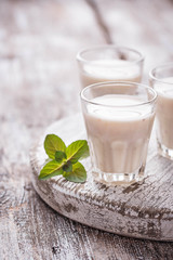 Greek yogurt on light wooden table