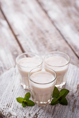 Greek yogurt on light wooden table