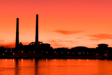 The evening thermal power station on the Neva river embankment in Saint Petersburg, Russia