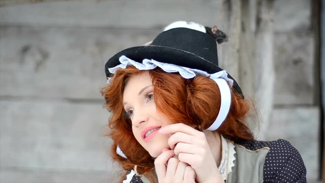 Red-haired girl with a magic rat. Fairy tale characters. close-up
