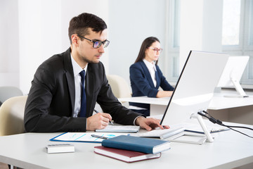 Young businessman working in an office