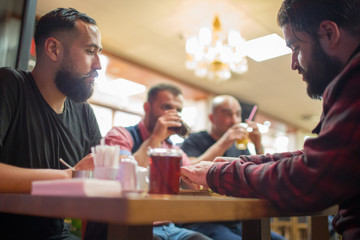 Middle Eastern people enjoying a traditional Iftar meal
