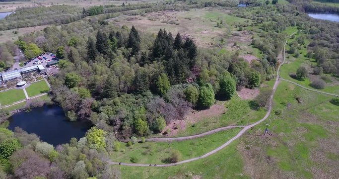 Aerial footage over Mugdock Country Park near Milngavie in Central Scotland.