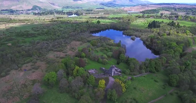 Aerial footage over Mugdock Country Park near Milngavie in Central Scotland.