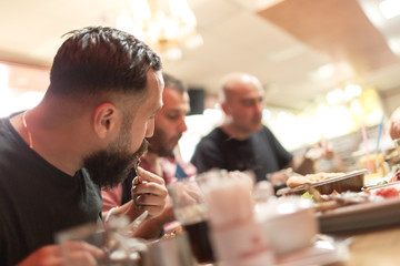 Muslim people enjoying a traditional Iftar meal