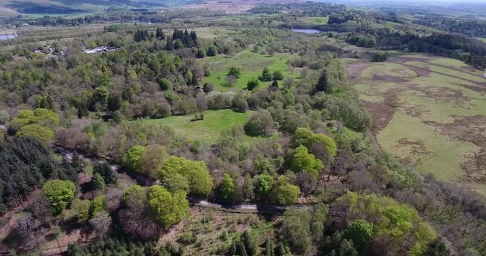 Aerial footage over Mugdock Country Park near Milngavie in Central Scotland.