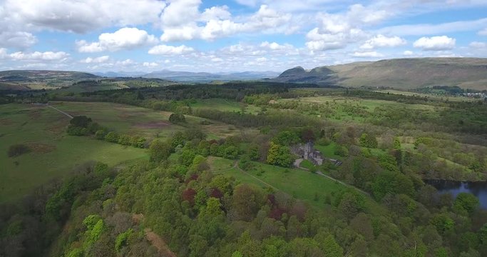 Aerial footage over Mugdock Country Park near Milngavie in Central Scotland.