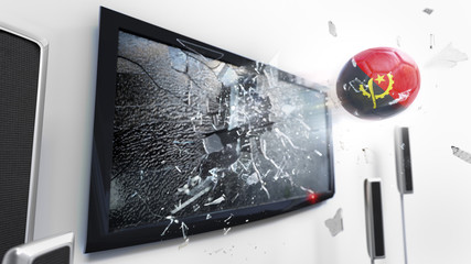 Soccer ball with the flag of Angola kicked through a shattering tv screen.(3D rendering series)