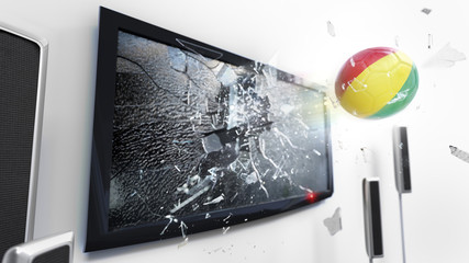 Soccer ball with the flag of Guinea kicked through a shattering tv screen.(3D rendering series)