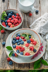 Closeup of granola with milk and fresh berry fruits