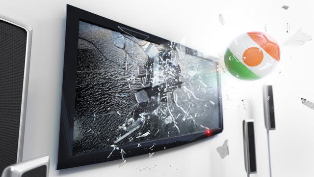 Soccer ball with the flag of Niger kicked through a shattering tv screen.(3D rendering series)