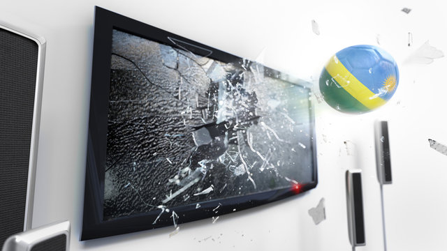 Soccer ball with the flag of Rwanda kicked through a shattering tv screen.(3D rendering series)