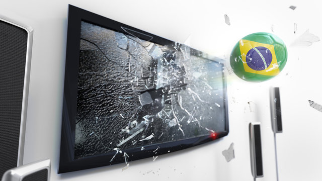 Soccer ball with the flag of Brazil kicked through a shattering tv screen.(3D rendering series)