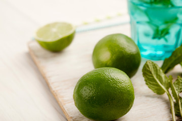 Making lemonade at home, ingredients on white wooden table