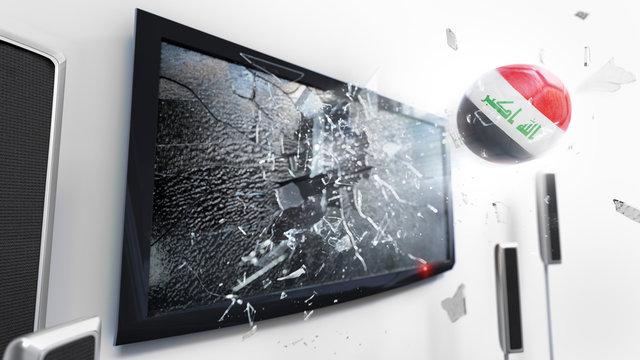 Soccer ball with the flag of Iraq kicked through a shattering tv screen.(3D rendering series)