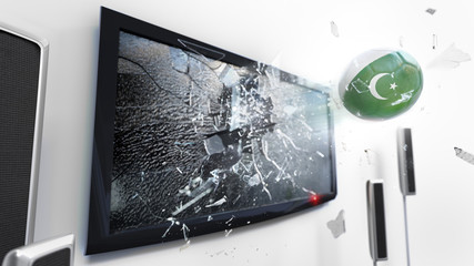 Soccer ball with the flag of Pakistan kicked through a shattering tv screen.(3D rendering series)
