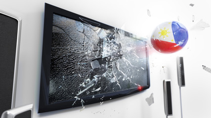Soccer ball with the flag of Philippines kicked through a shattering tv screen.(3D rendering series)