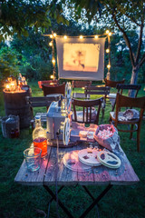 Small cinema with old analog films in summer garden